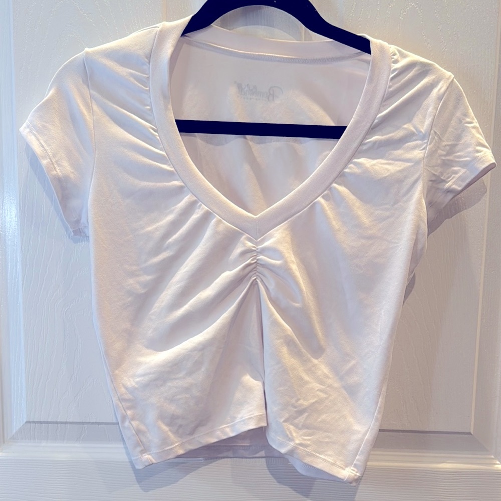 Bombshell Sportswear White V-Neck Ruched Crop Top